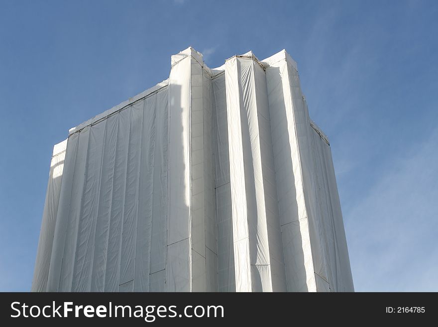 Currently under renovation, this high-rise tower is encased in white sheets. Currently under renovation, this high-rise tower is encased in white sheets.