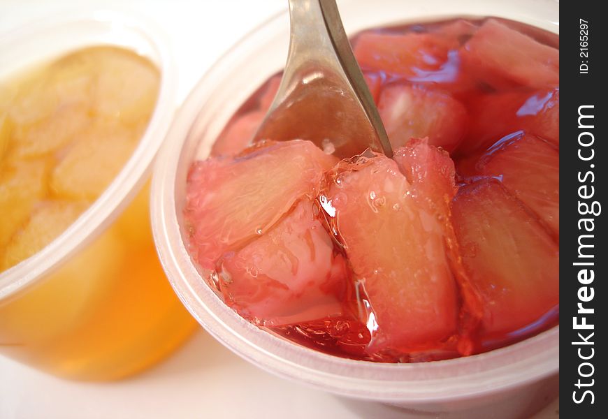 Red and yellow jelly with spoon