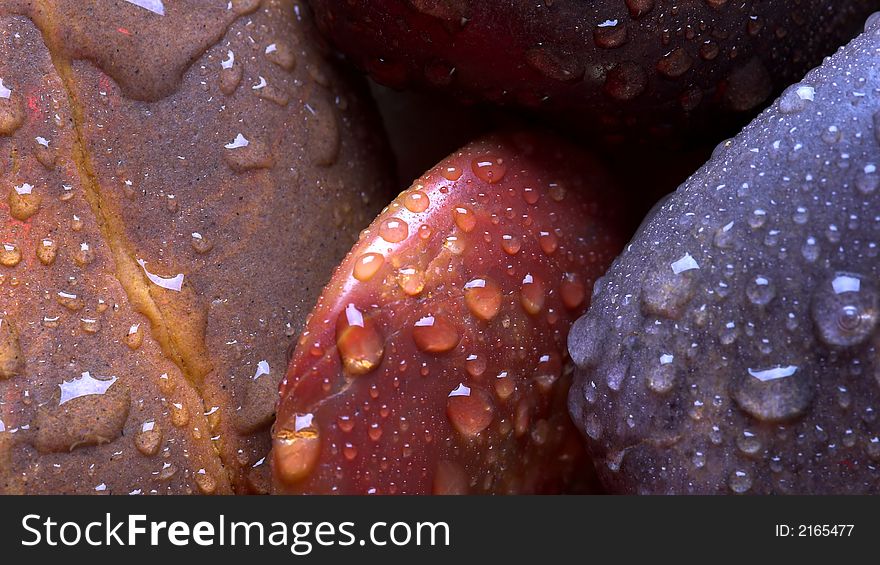 Assorted pebbles with water droplets. Assorted pebbles with water droplets