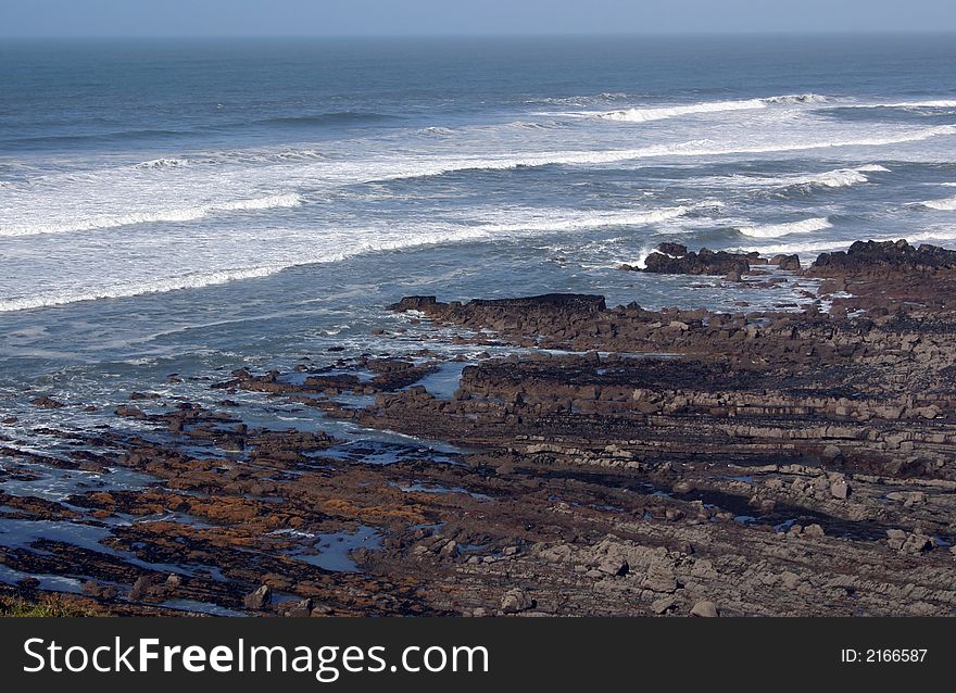 Waves coming over the rocks of a rocky coastline