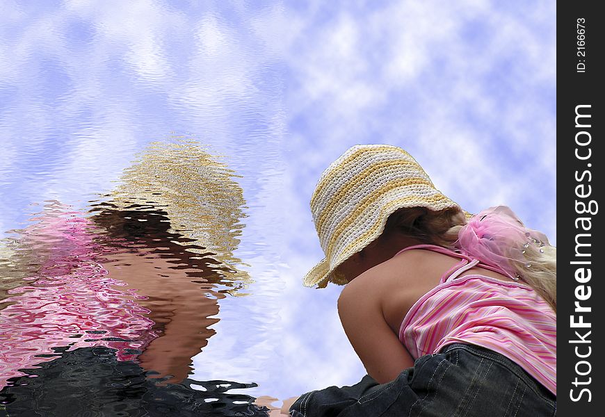 A nice baby with colourful cloth and her reflex on the water. A nice baby with colourful cloth and her reflex on the water