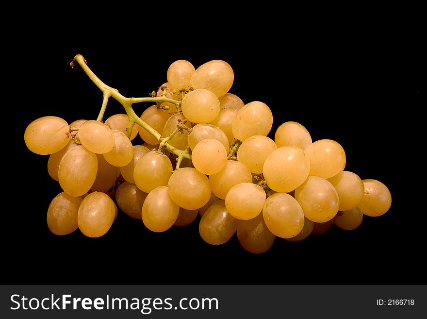 A bunch of white grapes isolated on black