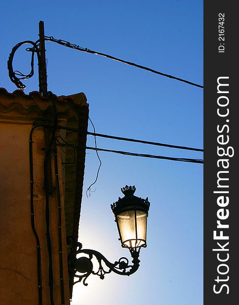 Mediterranean lantern and electricity cables at roof