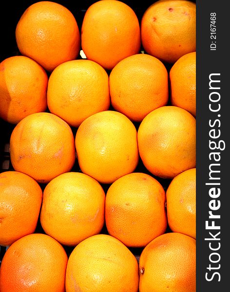 Pile of fresh oranges in a fruitshop