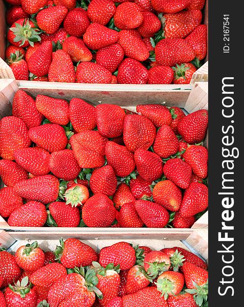 Strawberries on wooden box in the fruitshop. Strawberries on wooden box in the fruitshop