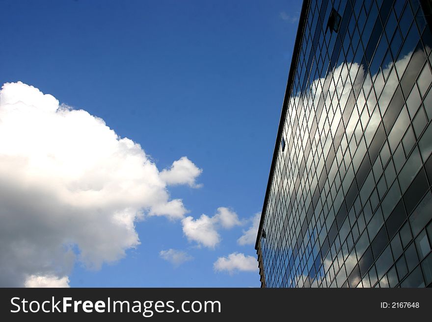 Skyscraper in Berlin serving as a mirror for the cloud. Skyscraper in Berlin serving as a mirror for the cloud