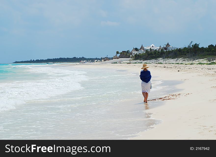 Beautiful Carribbean beach with white sand, woman walking. Beautiful Carribbean beach with white sand, woman walking