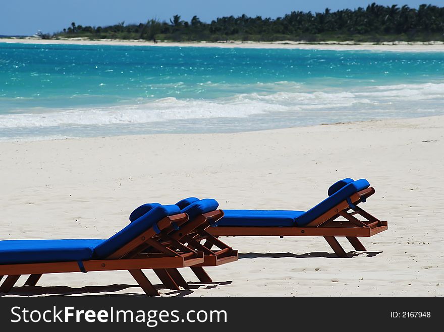 Beautiful Carribbean beach with white sand and chairs. Beautiful Carribbean beach with white sand and chairs