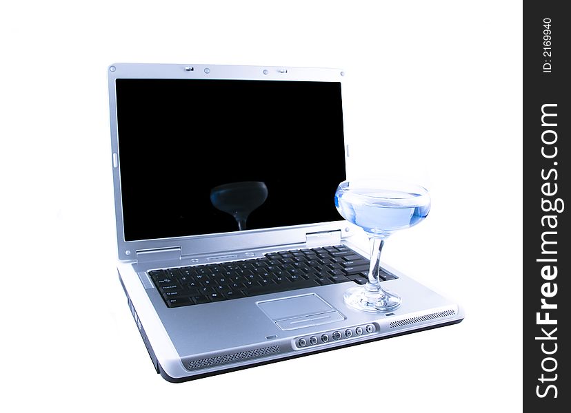 Laptop and a glass with a blue cocktail selected on a white background