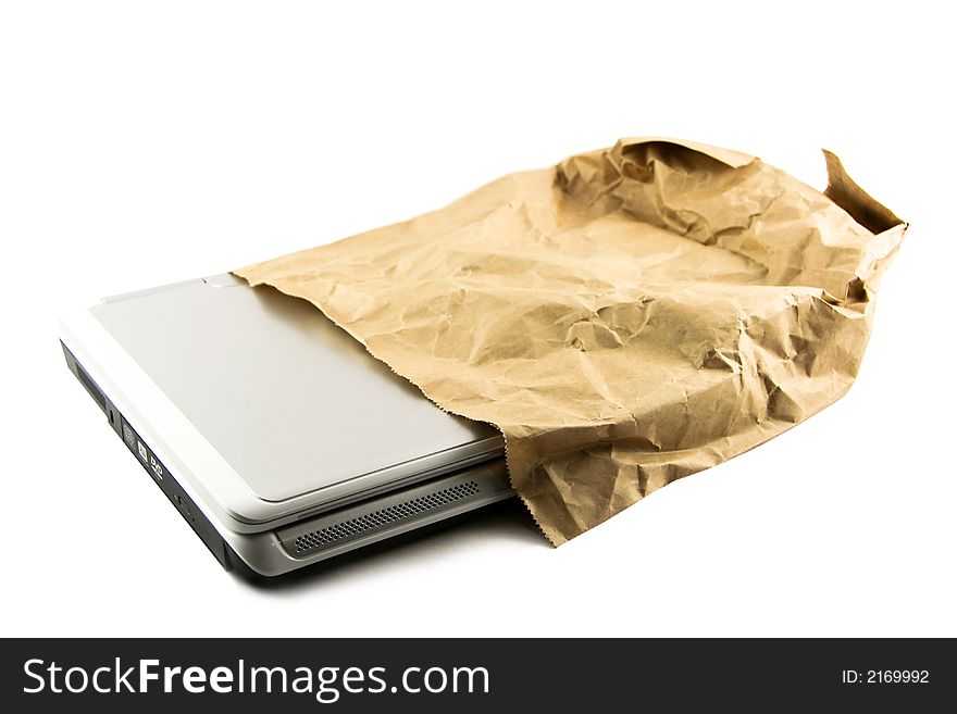 Laptop getting out from a shopping bag selected on a white background