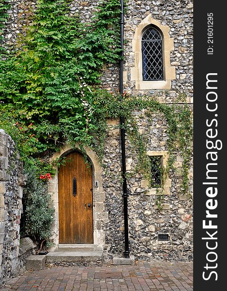 Wooden doorway in stone wall, Canterbury England. Wooden doorway in stone wall, Canterbury England
