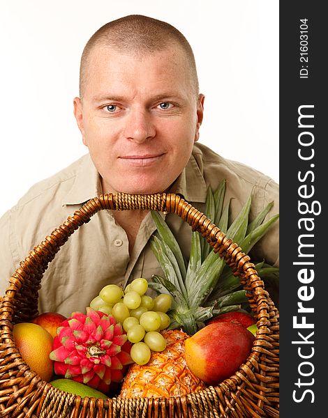 Man with a cane basket of fruit in the mouth. Man with a cane basket of fruit in the mouth