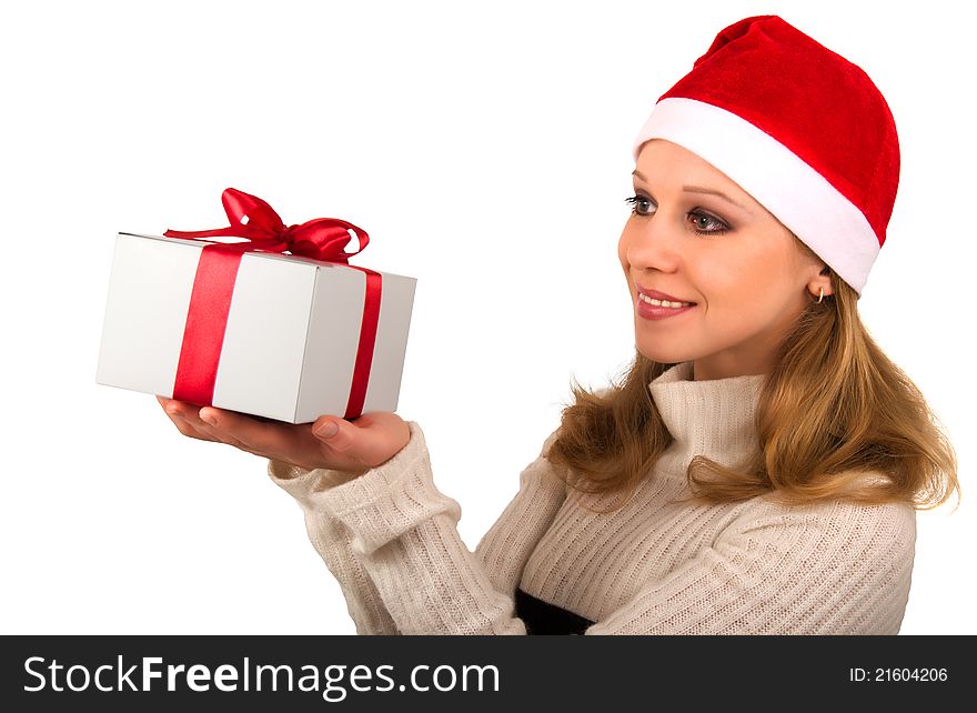 Attractive young girl with Christmas present on a white background