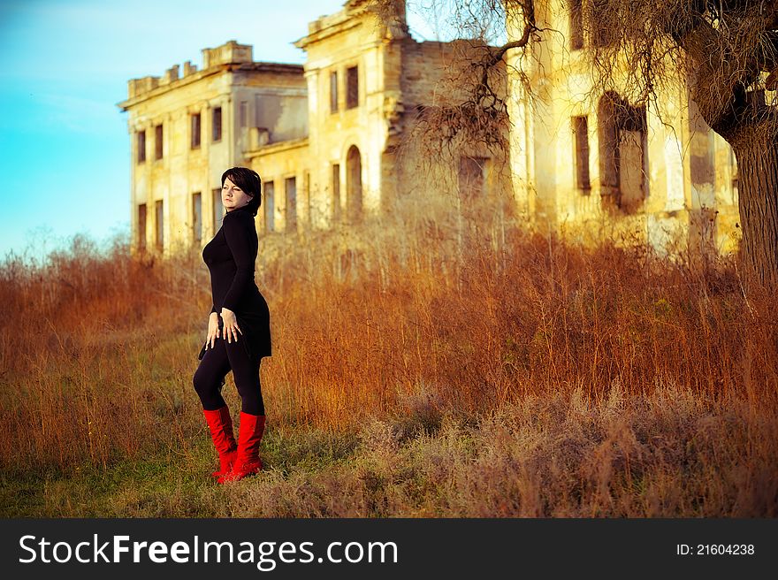 The girl against the old house. The girl against the old house