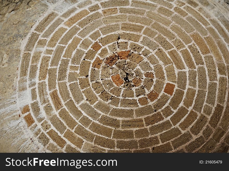 Abstraction-circle from bricks it is drawn by a chalk