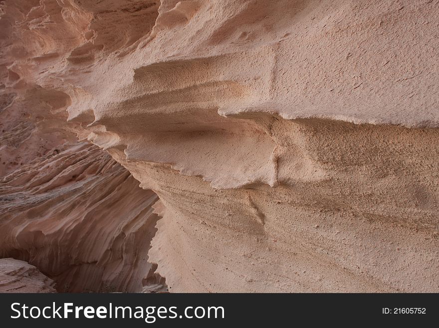 Structure of beautiful rocks on a decline, Pink Rock Face background