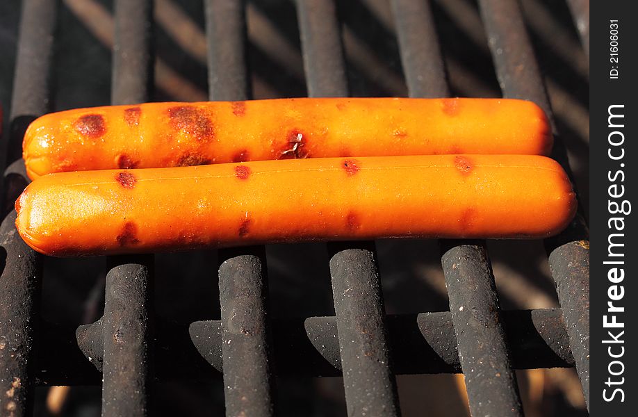 Hot Dogs Cooking on Campground Grill