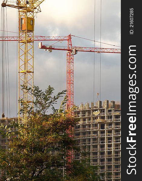 Background with development and crane, against sky. Background with development and crane, against sky