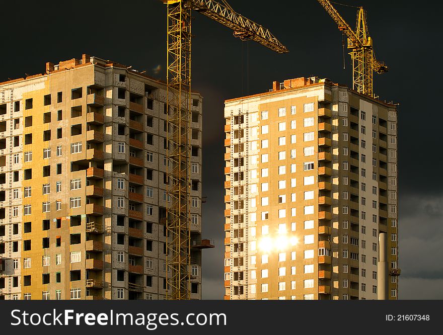 Background with development and crane, against sky. Background with development and crane, against sky