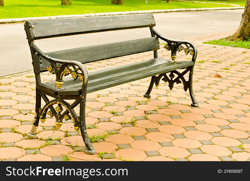 Old arm chair setting in park