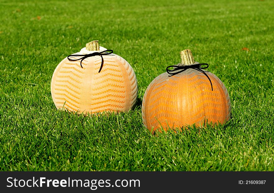 Picture of Halloween pumpkins, standing on a lawn
