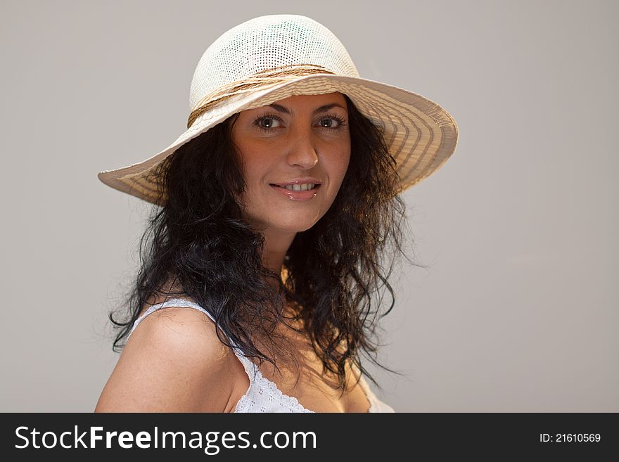 Happy smiling mature woman in straw hat. Happy smiling mature woman in straw hat