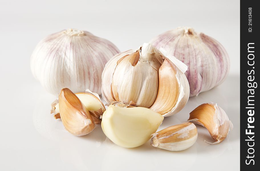 Flavorful purple striped garlic photographed on white background. Flavorful purple striped garlic photographed on white background