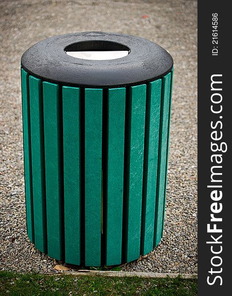 A unique, green, modern public trash bin. A unique, green, modern public trash bin.