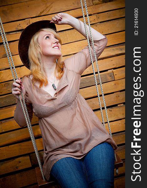 Pretty cowboy girl in farm interior. Pretty cowboy girl in farm interior