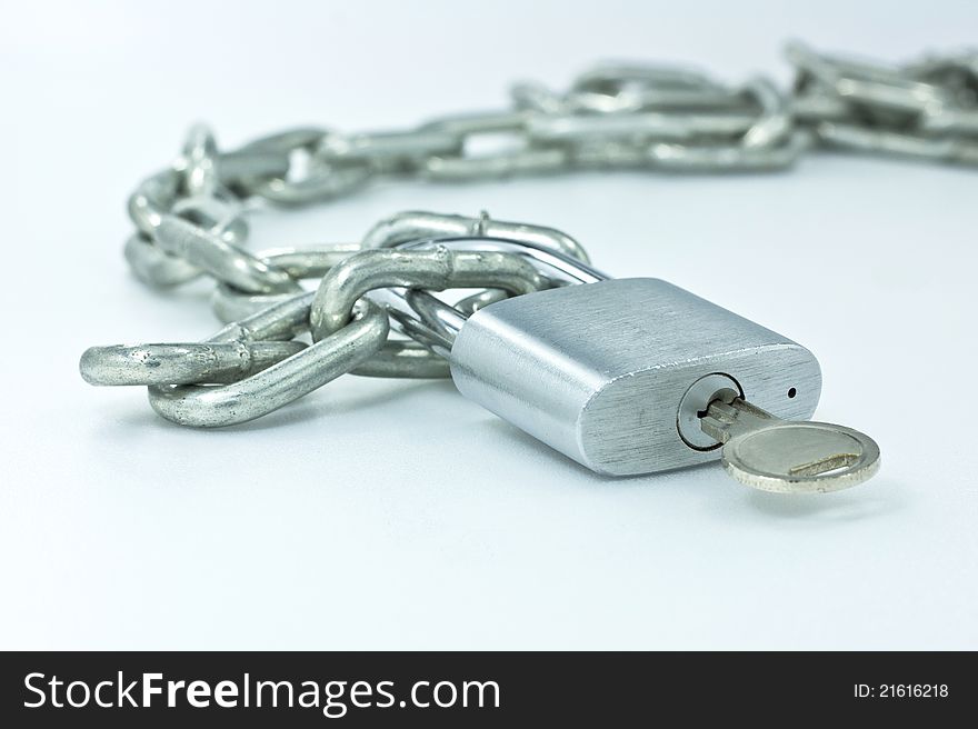 Open padlock and chains on white background.