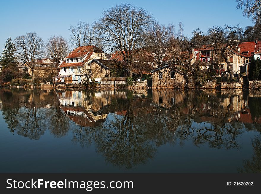 The city of Montbeliard, France. Reflection in the river. The city of Montbeliard, France. Reflection in the river.