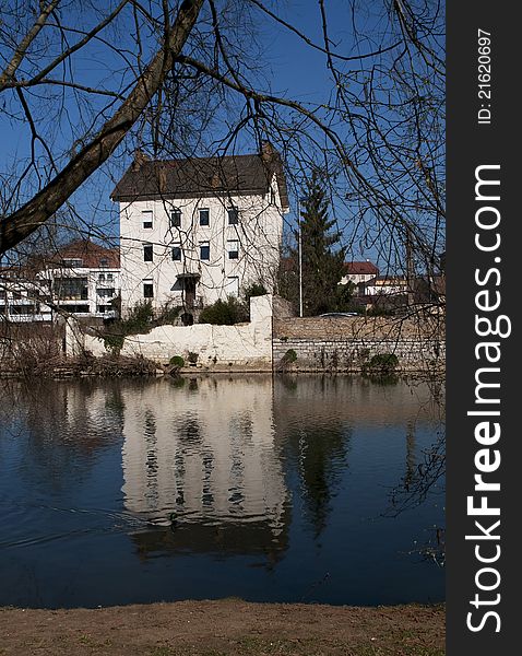 The city of Montbeliard, France. Reflection in the river. The city of Montbeliard, France. Reflection in the river.