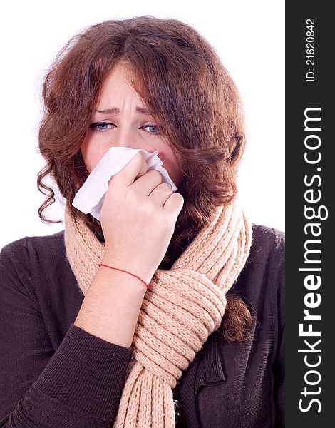 Girl with wet hair blowing her nose-over white