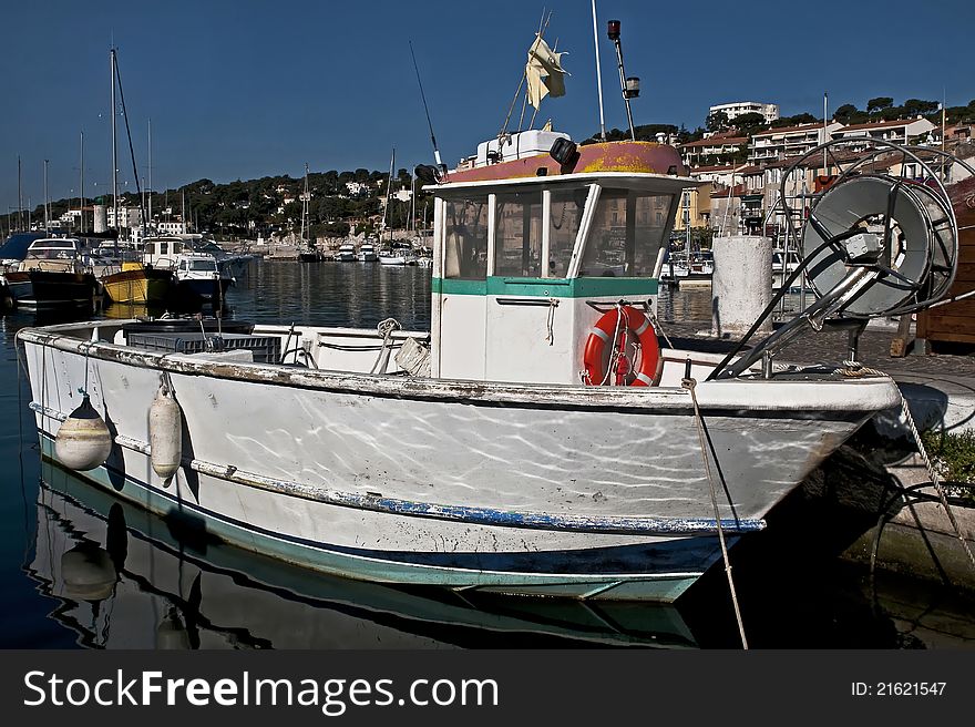 Fishing boat at its moorings in the port of Cassis, south-east of France. Fishing boat at its moorings in the port of Cassis, south-east of France.