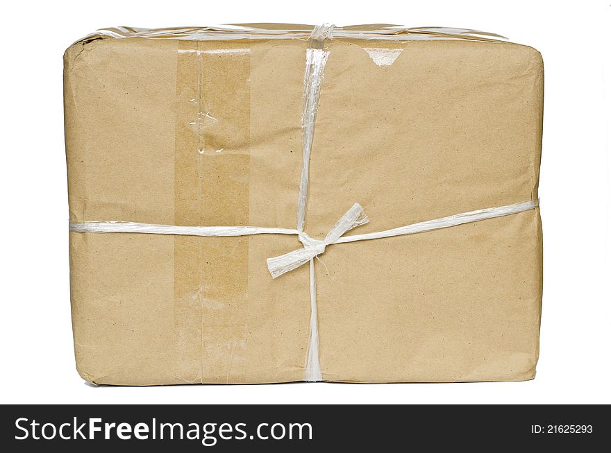A parcel wrapped in brown paper blank label, isolated on white background. A parcel wrapped in brown paper blank label, isolated on white background