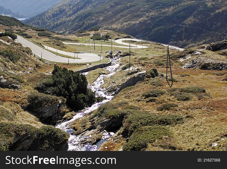 Bending road in a high altitude mountain area of the swiss alps close to San Bernardino  Pass. Bending road in a high altitude mountain area of the swiss alps close to San Bernardino  Pass