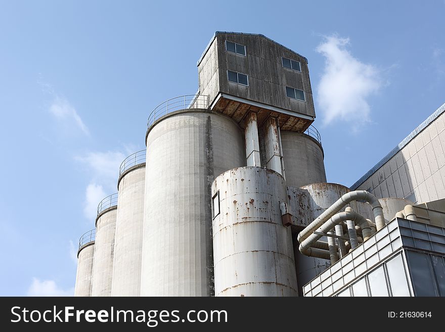 Photograph of storage silo and blue sky. Photograph of storage silo and blue sky