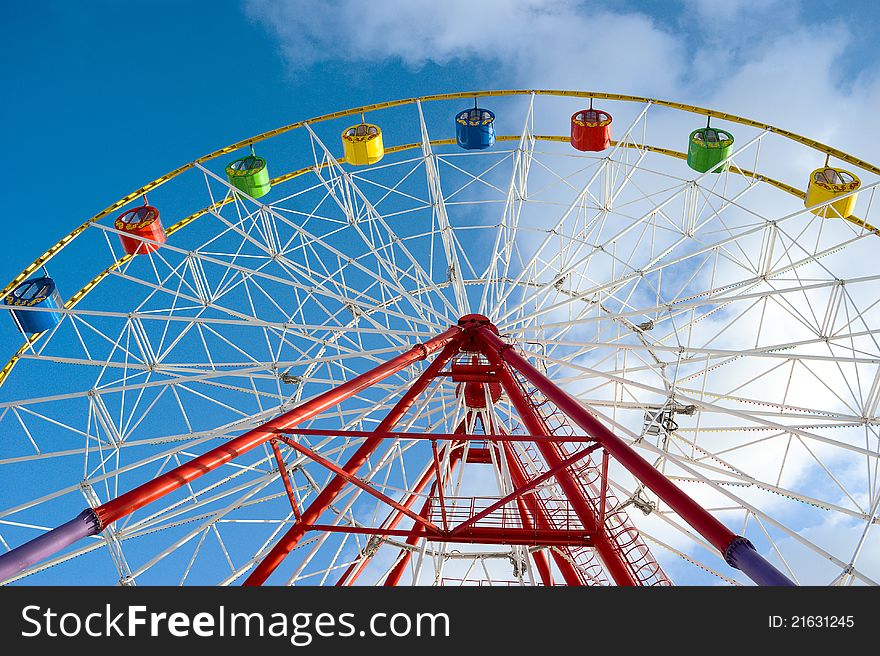Attraction ferris wheel on blue sky background