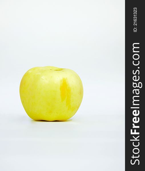 Isolated yellow apple on white background