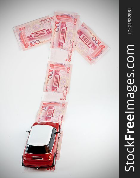 Red car and RMB notes. Red car and RMB notes