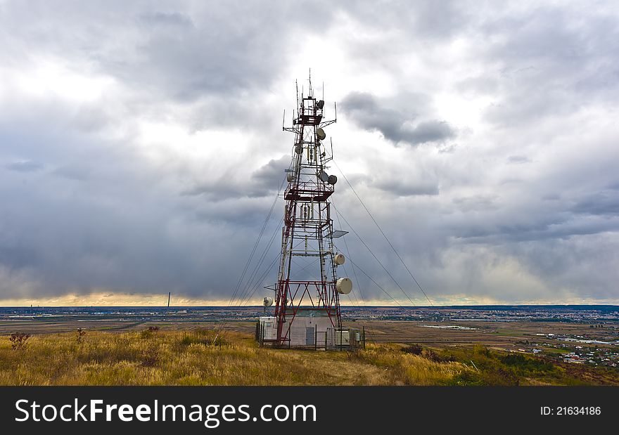 Communications tower above the city landscape