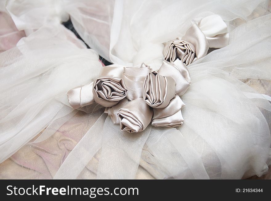 Bride dress detail with silk flowers. Bride dress detail with silk flowers