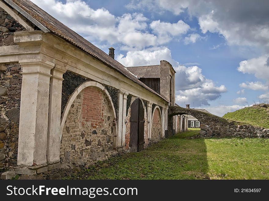 A view of Lithuanian Manor House in Pakruojas surrounded by a high stone wall