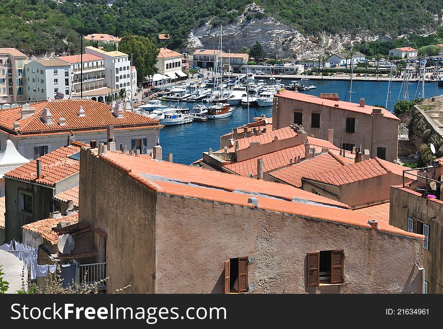 Marina in the hollow of a bay surrounded by houses and buildings. Marina in the hollow of a bay surrounded by houses and buildings