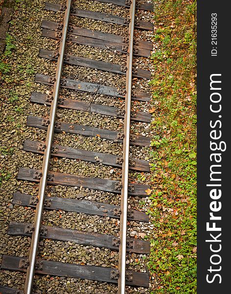 Steel rails with wooden sleepers, shot from the top