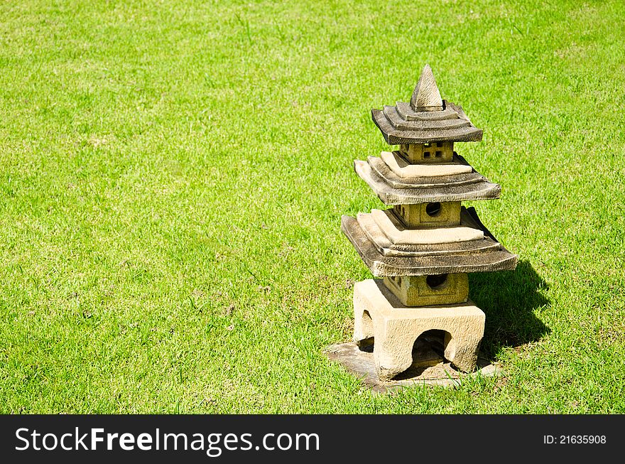 Chinese pavilion, carved out of stone on the lawn.