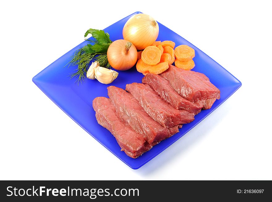 Fresh raw beef steak on a blue plate, on a white background. Fresh raw beef steak on a blue plate, on a white background