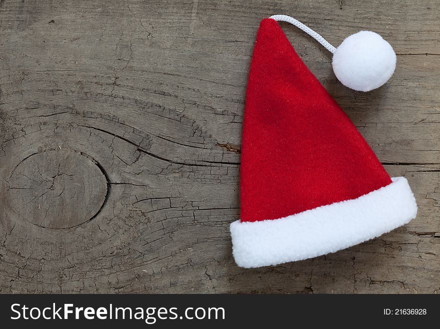 Santa hat on wooden background with copy space