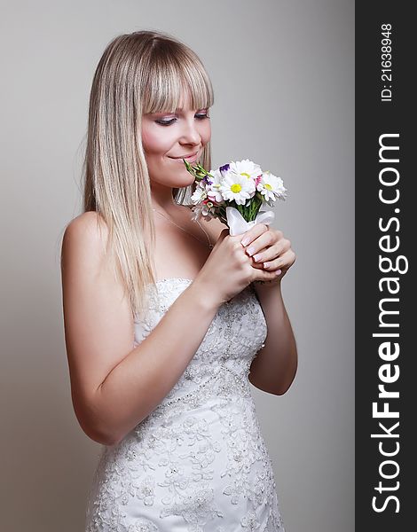 Portrait of happy bride with a bouquet. Portrait of happy bride with a bouquet