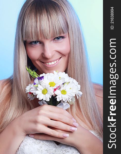 Beautiful Young Woman With A Bouquet Of Flowers